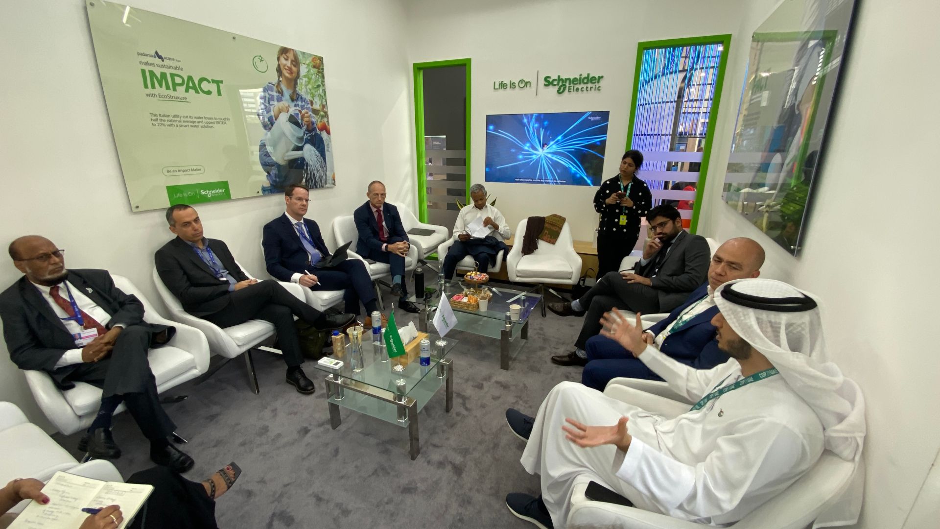 Group of participants sitting in a circle discussing in the panel discussion. 