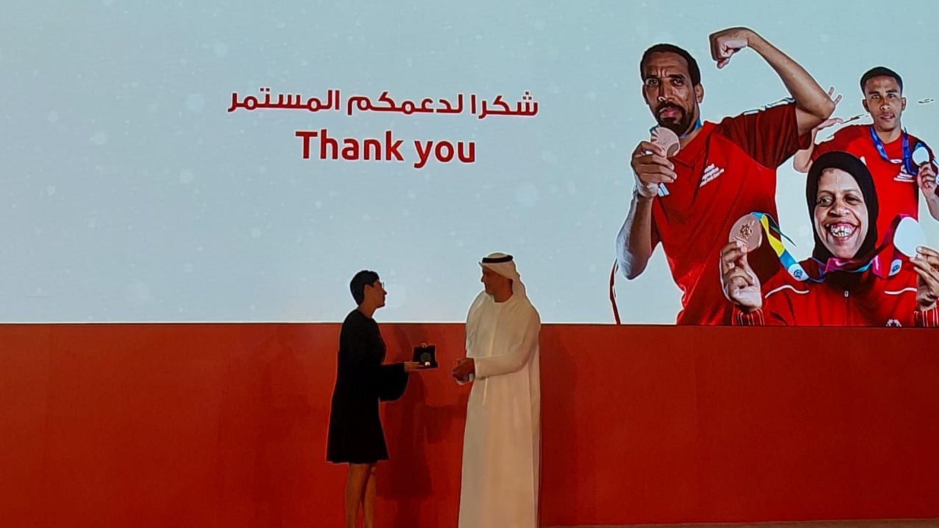Receiving award from UAE Special Olympics