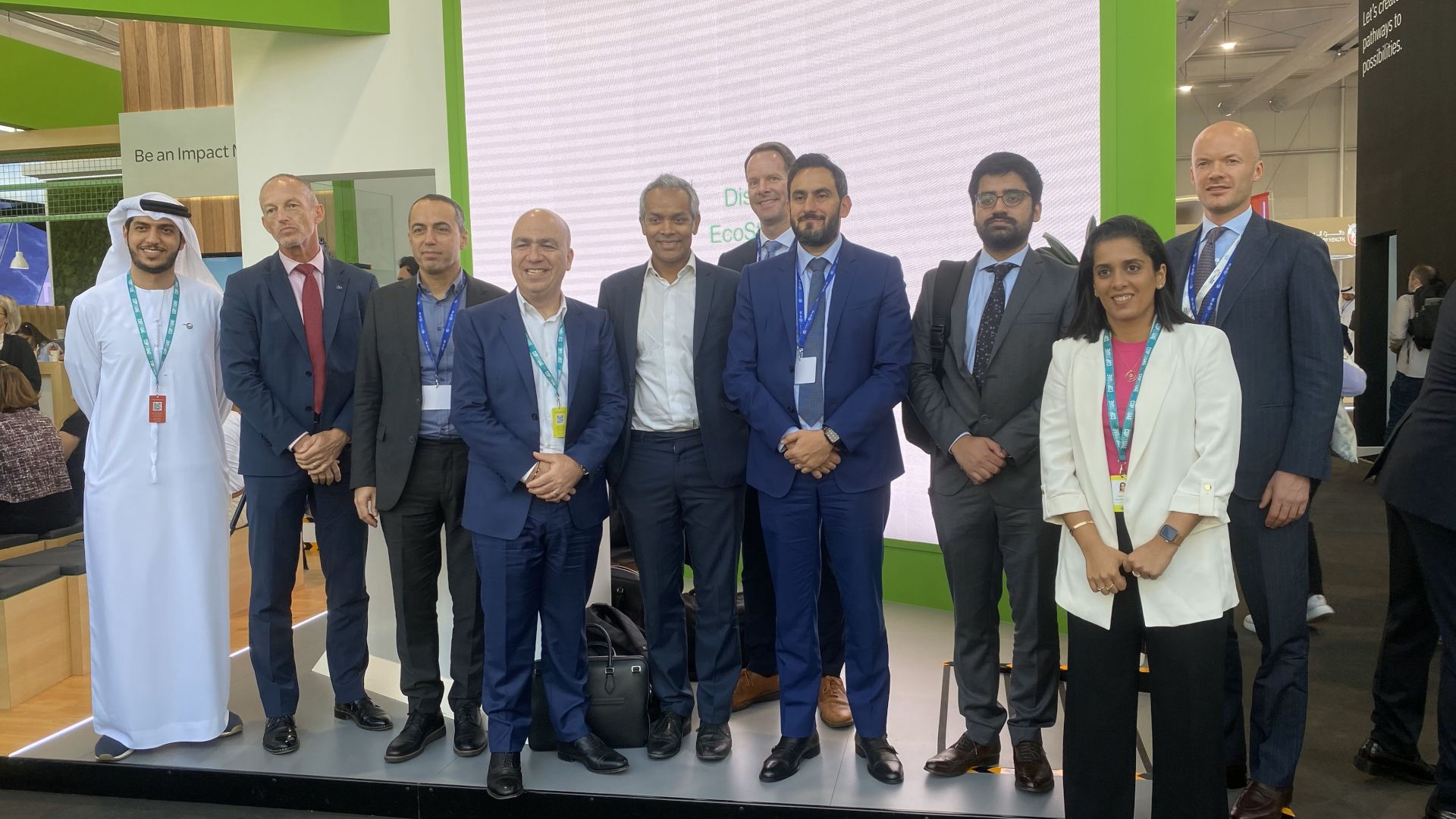 Group of participants taking a picture for completing the panel discussion on energy transition industrial sustainability.