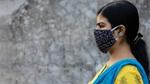 Side Face of an Indian woman wearing homemade cotton nose mask to reduce the spread of Covid-19 – stock photo