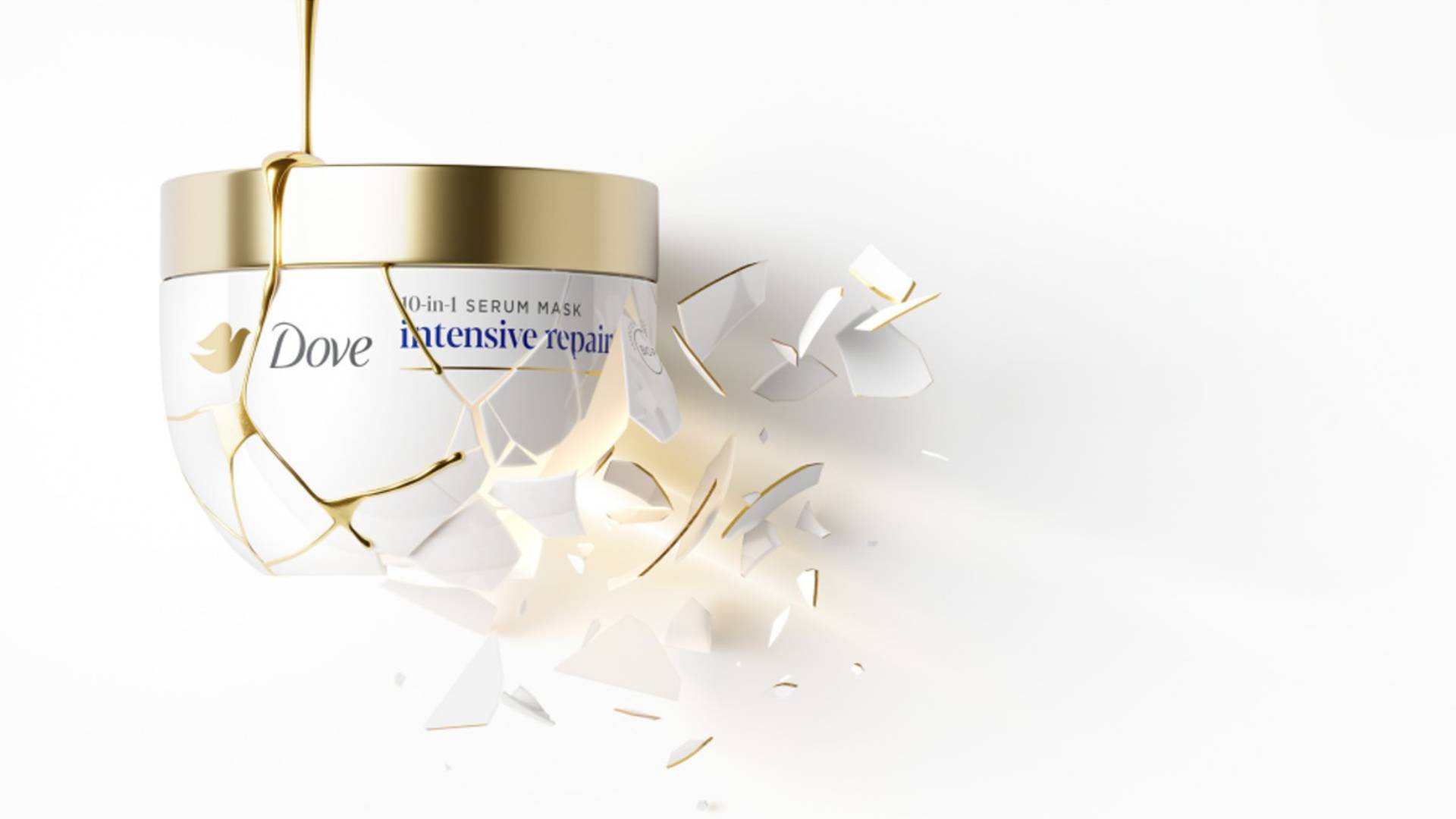 A jar of Dove’s premium Intensive Care hair repair mask, shattered and mended with molten gold in a Kintsugi style.